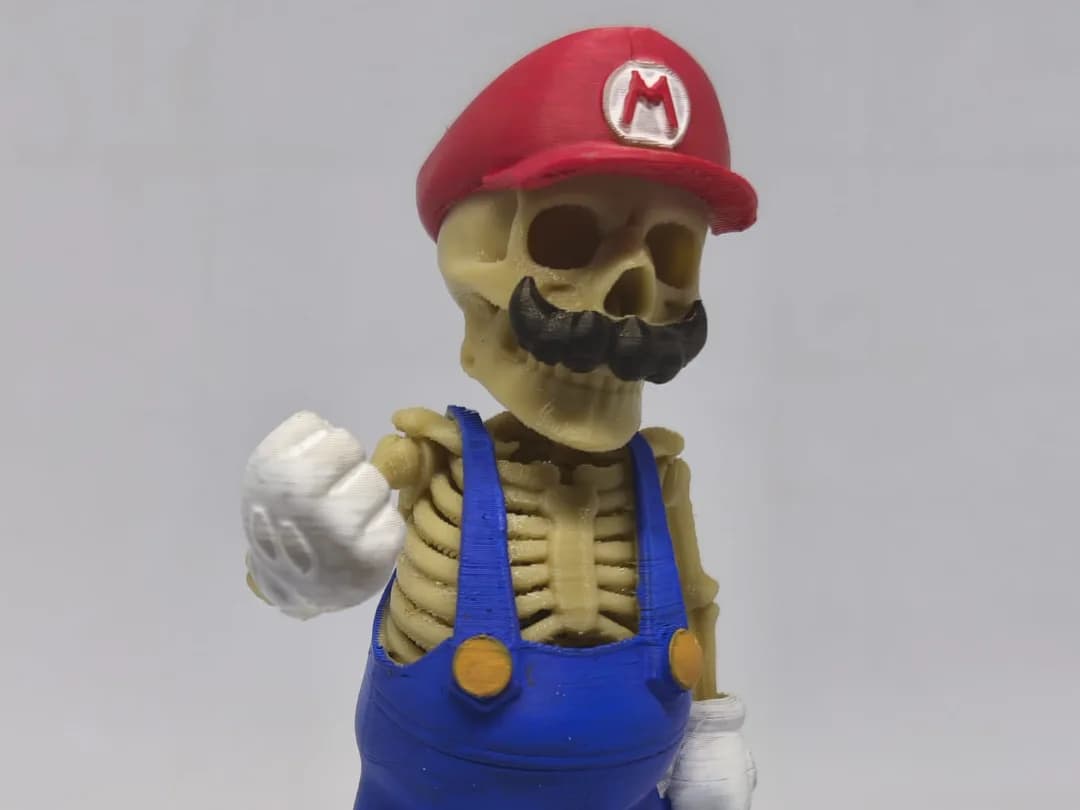 Estatueta Esqueleto Encanador de Boné Vermelho Impressão 3D